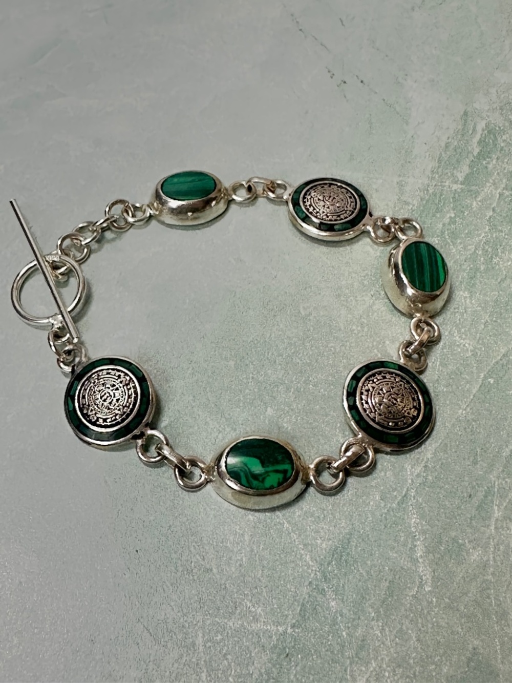 Vintage sterling silver and malachite green stone Aztec calendar disk bracelet